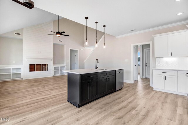 186 Gumtop Dr, Zebulon, NC 27597 - kitchen with a sink, dishwasher, light countertops, white cabinetry, and crown molding