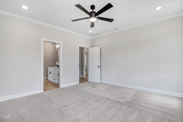 186 Gumtop Dr, Zebulon, NC 27597 - unfurnished bedroom featuring light colored carpet, crown molding, recessed lighting, baseboards, and ensuite bath
