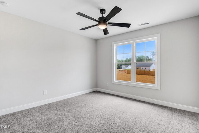 186 Gumtop Dr, Zebulon, NC 27597 - carpeted empty room with baseboards, a smoke detector, and ceiling fan