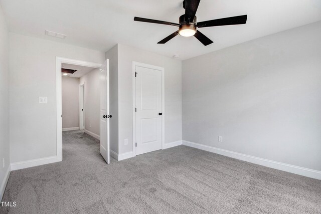 186 Gumtop Dr, Zebulon, NC 27597 - unfurnished bedroom with baseboards, carpet flooring, and a ceiling fan