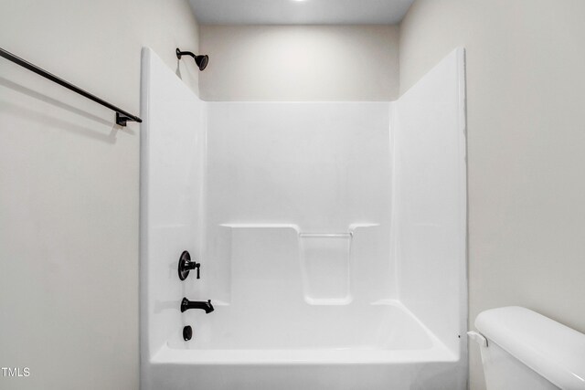 186 Gumtop Dr, Zebulon, NC 27597 - bathroom featuring toilet and washtub / shower combination