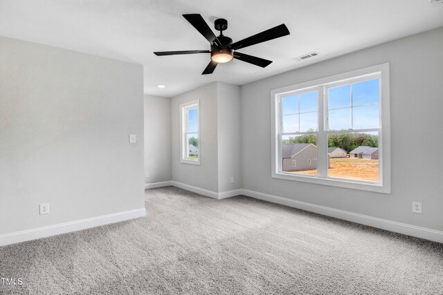 186 Gumtop Dr, Zebulon, NC 27597 - spare room with carpet, baseboards, and a ceiling fan