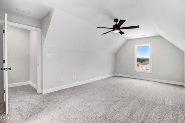 186 Gumtop Dr, Zebulon, NC 27597 - additional living space featuring carpet floors, baseboards, vaulted ceiling, and a ceiling fan