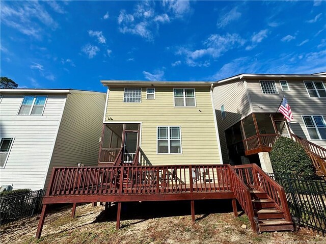 1477 Micahs Way N, Spring Lake, NC 28390 - back of house featuring a wooden deck and a sunroom
