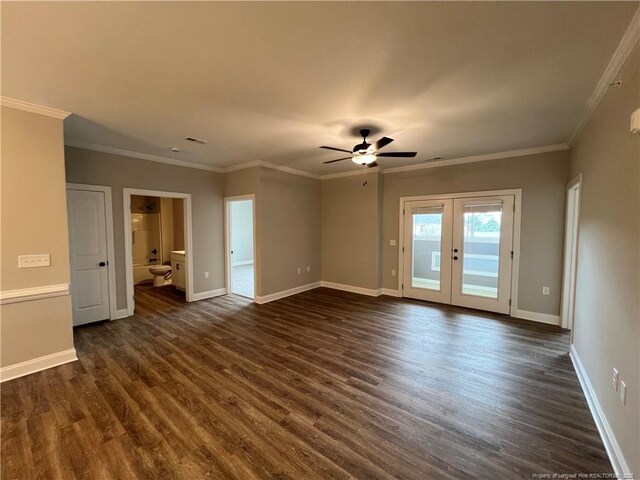 unfurnished room featuring crown molding, french doors, a ceiling fan, baseboards, and dark wood-style flooring