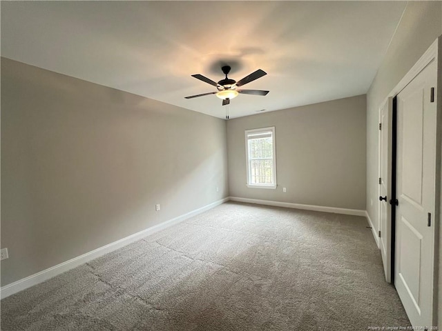unfurnished bedroom with baseboards, ceiling fan, and carpet flooring