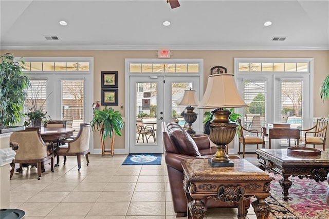 interior space with visible vents, a healthy amount of sunlight, and crown molding