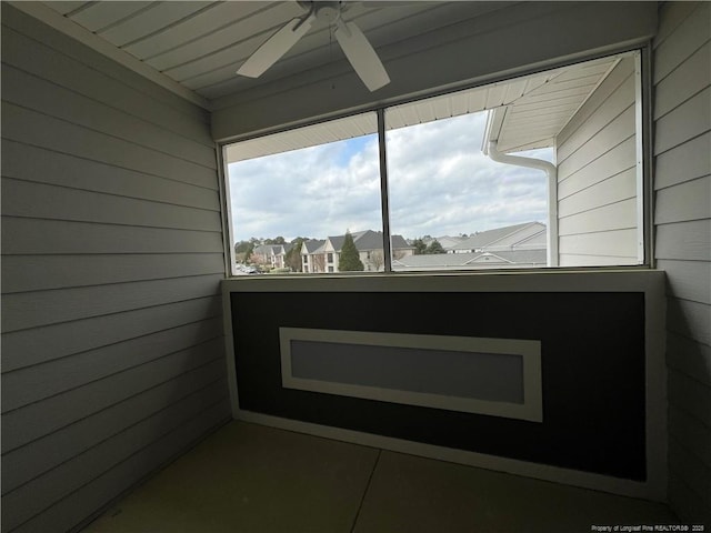 unfurnished sunroom featuring a residential view