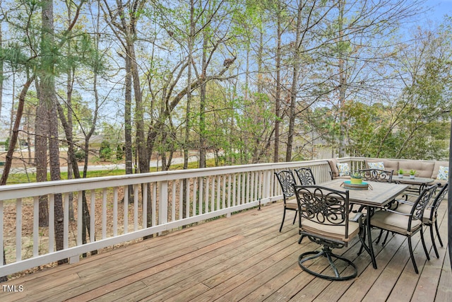 deck featuring outdoor dining area