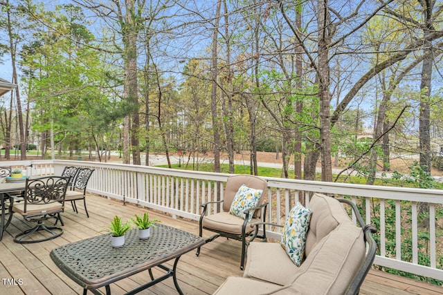 wooden deck featuring outdoor dining area and outdoor lounge area