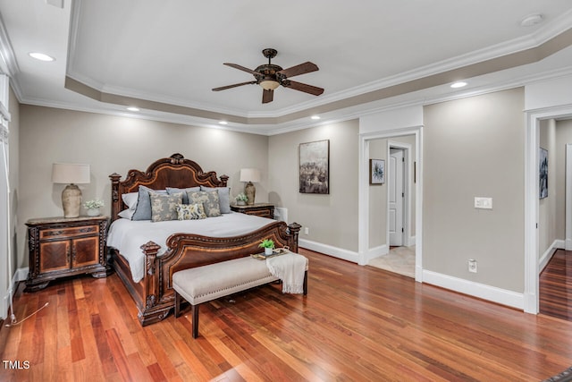 bedroom featuring recessed lighting, ornamental molding, baseboards, and wood finished floors