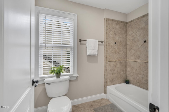 full bathroom with baseboards, toilet, tile patterned flooring, and shower / washtub combination