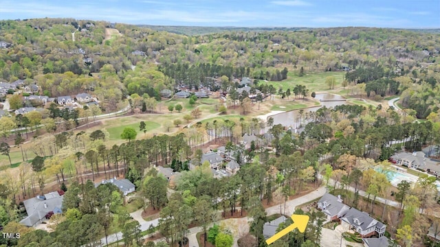 bird's eye view with a water view and a forest view