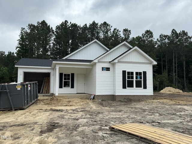 1582 Patterson Rd, Kinston, NC 28504 - view of front of house with a garage and board and batten siding
