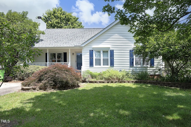109 Perry Farms Dr, Apex, NC 27502 - view of front of house featuring a shingled roof, a front yard, a chimney, and a porch