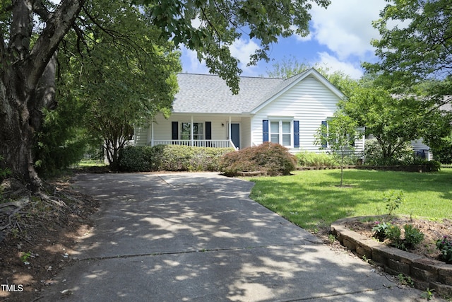 109 Perry Farms Dr, Apex, NC 27502 - ranch-style house with a porch, a shingled roof, and a front lawn