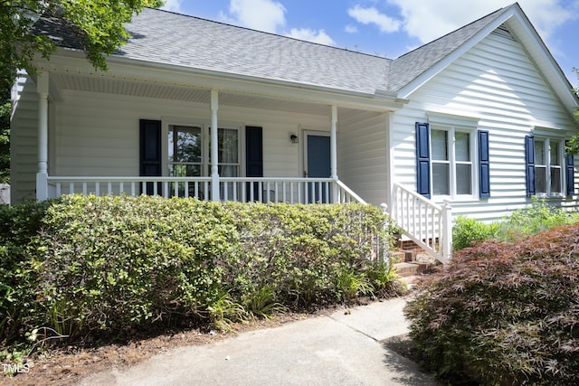 109 Perry Farms Dr, Apex, NC 27502 - view of front facade featuring a shingled roof, a porch, and stairs