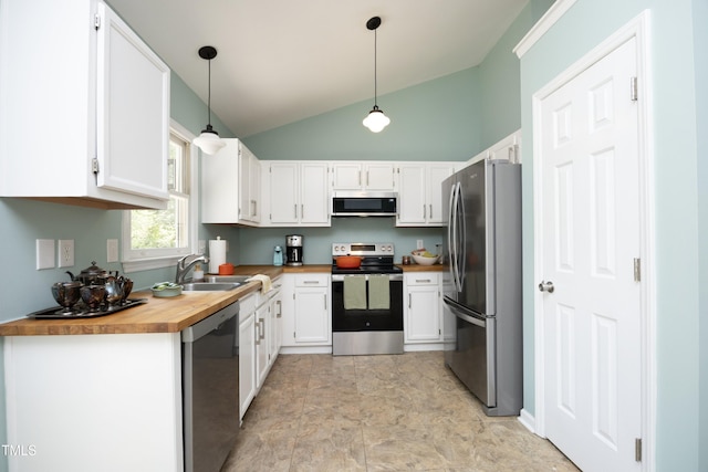 109 Perry Farms Dr, Apex, NC 27502 - kitchen with stainless steel appliances, wood counters, white cabinetry, a sink, and high vaulted ceiling