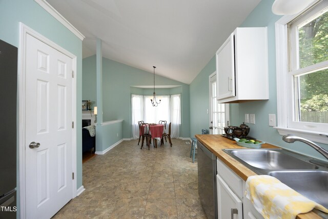 109 Perry Farms Dr, Apex, NC 27502 - kitchen with dishwasher, butcher block counters, white cabinets, lofted ceiling, and hanging light fixtures