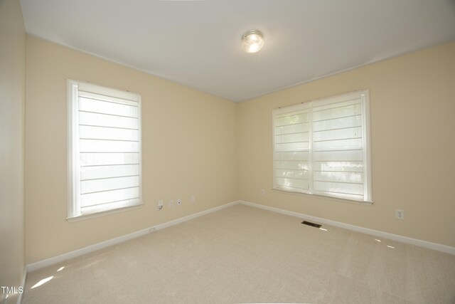 109 Perry Farms Dr, Apex, NC 27502 - unfurnished room with carpet floors, baseboards, and healthy amount of natural light