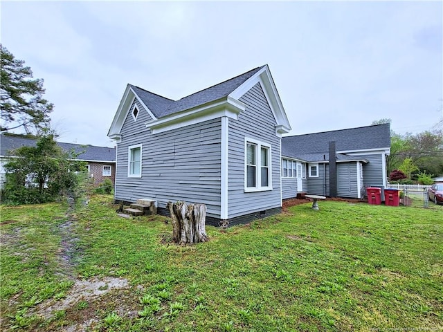 view of property exterior featuring a yard