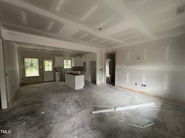 1572 Patterson Rd, Kinston, NC 28504 - unfurnished living room with baseboards