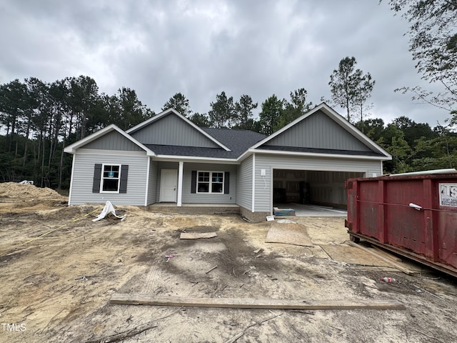 1572 Patterson Rd, Kinston, NC 28504 - view of front of home with a garage, driveway, roof with shingles, and covered porch