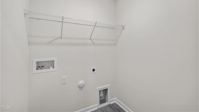 clothes washing area with hookup for a gas dryer, hookup for a washing machine, baseboards, laundry area, and electric dryer hookup