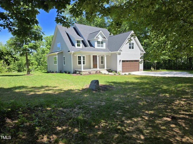 5480 Thom Rd, Mebane, NC 27302 - view of front facade with a porch, a front yard, concrete driveway, and an attached garage