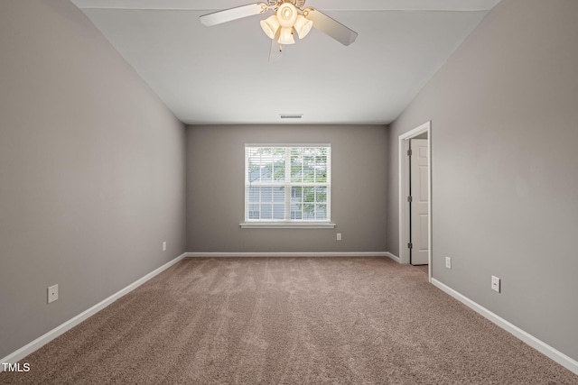 empty room with ceiling fan, carpet floors, and baseboards