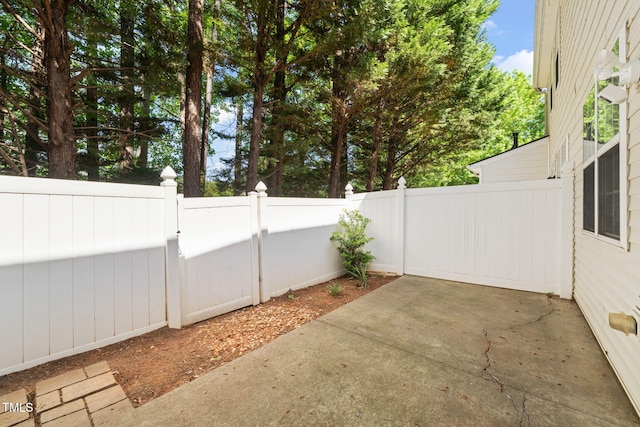 view of patio featuring a gate