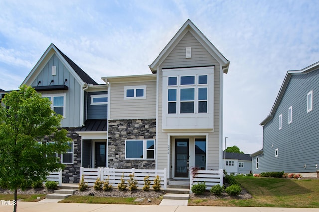 249 Wendover Pkwy, Pittsboro, NC 27312 - view of front of property featuring board and batten siding and stone siding