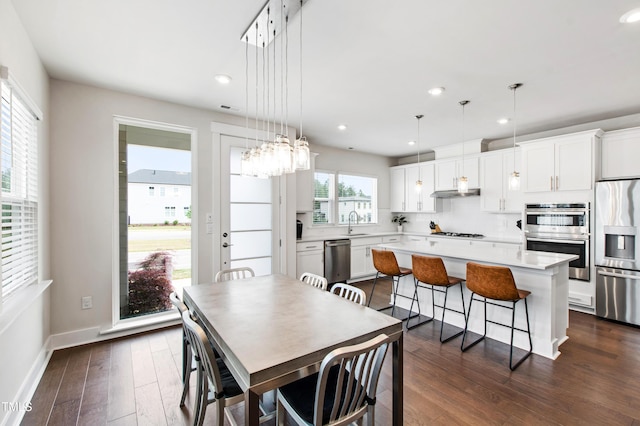 249 Wendover Pkwy, Pittsboro, NC 27312 - dining area with dark wood finished floors, recessed lighting, and baseboards