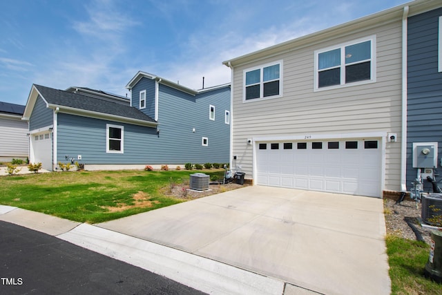 249 Wendover Pkwy, Pittsboro, NC 27312 - view of front facade featuring a garage, concrete driveway, central AC unit, and a front lawn