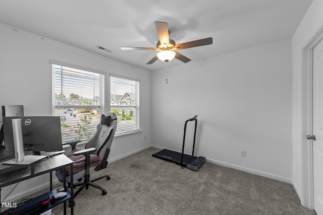 office area with carpet floors, visible vents, baseboards, and ceiling fan