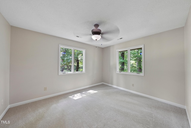 6601 Hidden Pond Rd, Wendell, NC 27591 - carpeted empty room featuring plenty of natural light, a textured ceiling, and a ceiling fan