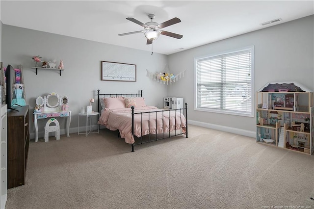 bedroom with baseboards, visible vents, ceiling fan, and carpet flooring