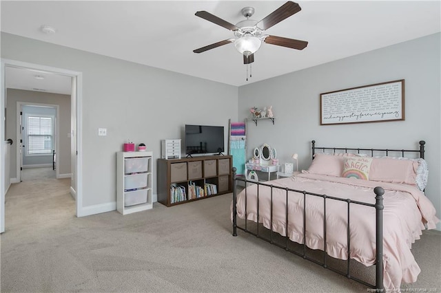 bedroom featuring a ceiling fan, carpet floors, and baseboards
