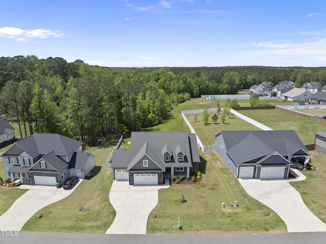 bird's eye view with a residential view and a wooded view