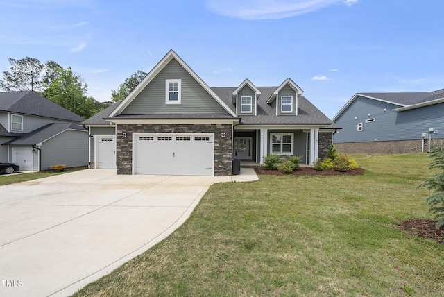 craftsman-style house with covered porch, concrete driveway, a front yard, and stone siding