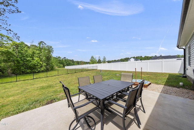 view of patio with outdoor dining space and a fenced backyard