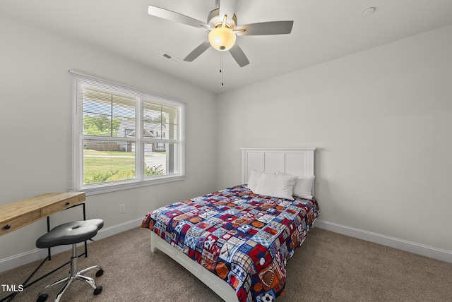 bedroom with visible vents, multiple windows, and carpet