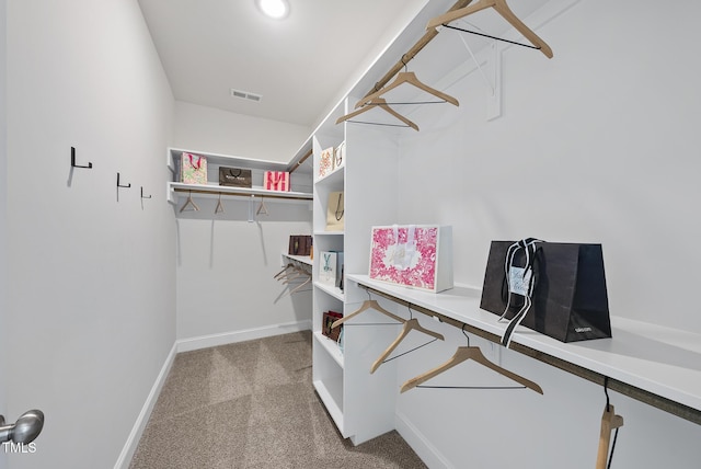 spacious closet with carpet and visible vents