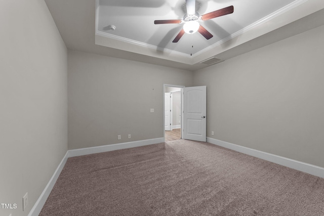 80 Bramble Ln, Clayton, NC 27527 - empty room with a raised ceiling, crown molding, carpet flooring, a ceiling fan, and baseboards