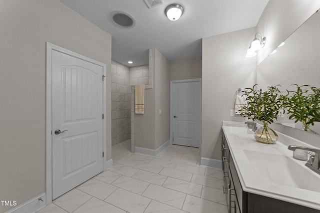 80 Bramble Ln, Clayton, NC 27527 - bathroom featuring marble finish floors, walk in shower, double vanity, and baseboards