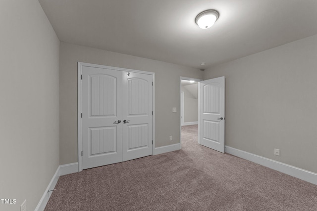 80 Bramble Ln, Clayton, NC 27527 - unfurnished bedroom featuring carpet floors, a closet, and baseboards