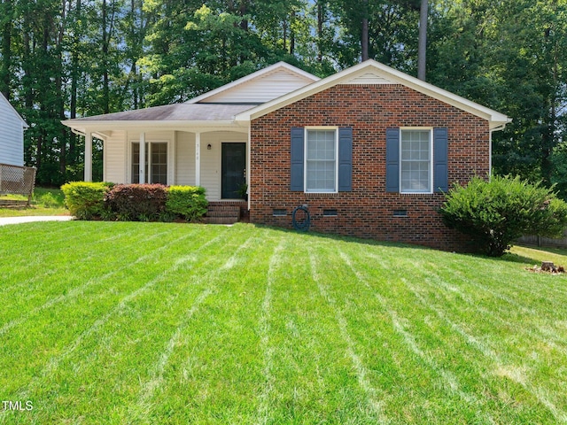 5148 Wallingford Dr, Raleigh, NC 27616 - view of front of home featuring a front lawn, covered porch, crawl space, and brick siding