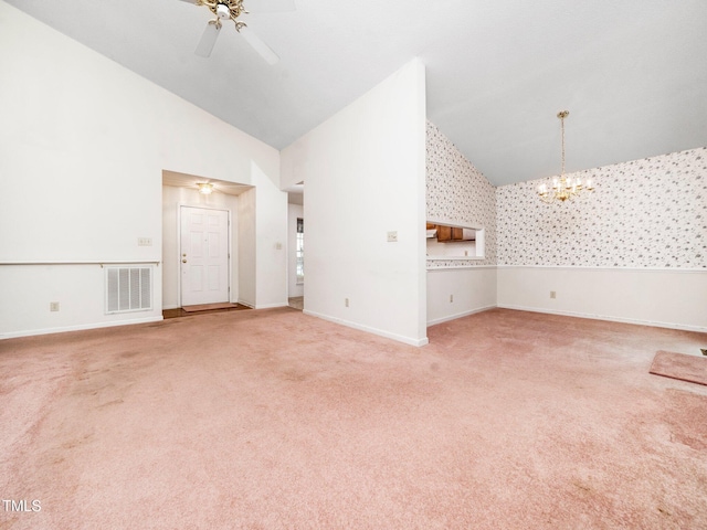 5148 Wallingford Dr, Raleigh, NC 27616 - unfurnished living room with ceiling fan, a chandelier, carpet flooring, high vaulted ceiling, and wallpapered walls
