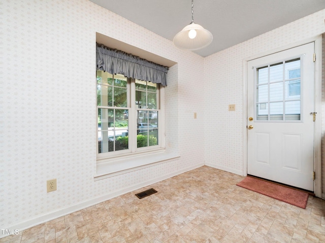 5148 Wallingford Dr, Raleigh, NC 27616 - foyer entrance with plenty of natural light and wallpapered walls