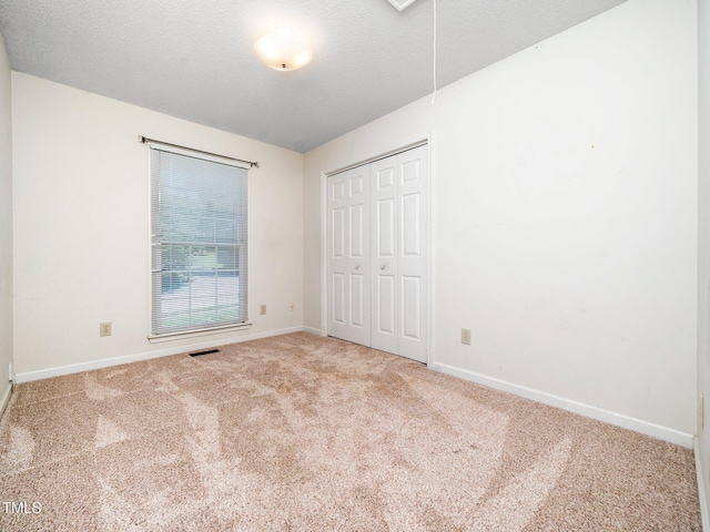 5148 Wallingford Dr, Raleigh, NC 27616 - unfurnished bedroom with carpet and a closet